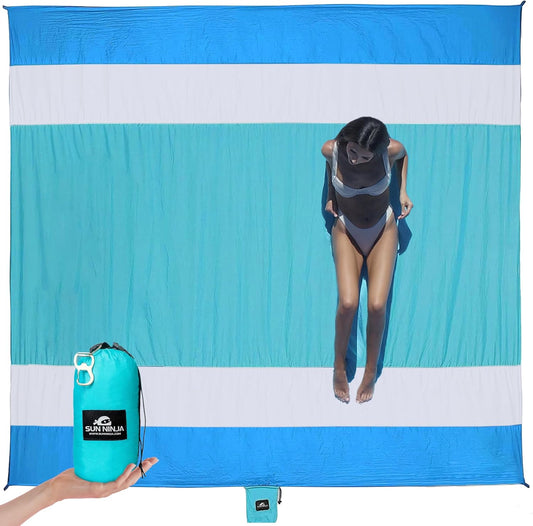 Sand-Free Beach Blanket - with Storage Pocket, Bottle Opener, Carabiner, Shoulder Straps, Corner Sandbags and 4 Stakes